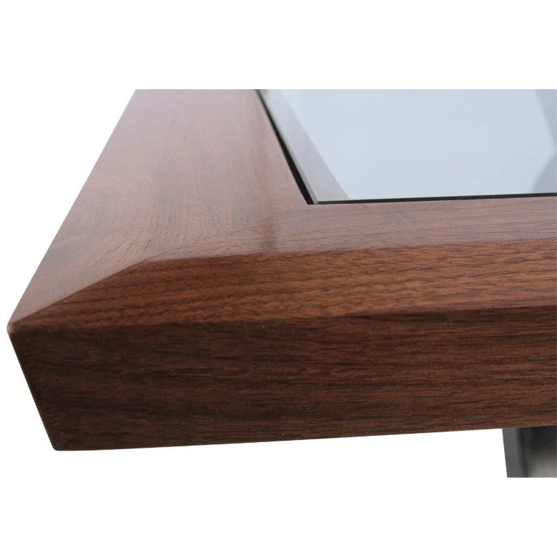 Close-up of a wooden framed table with a glass top