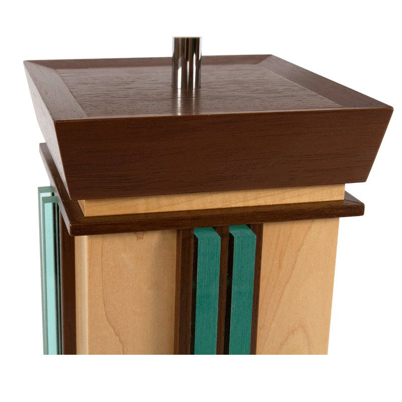 Close-up of a wooden lamp with various types of wood and acrylic accents.