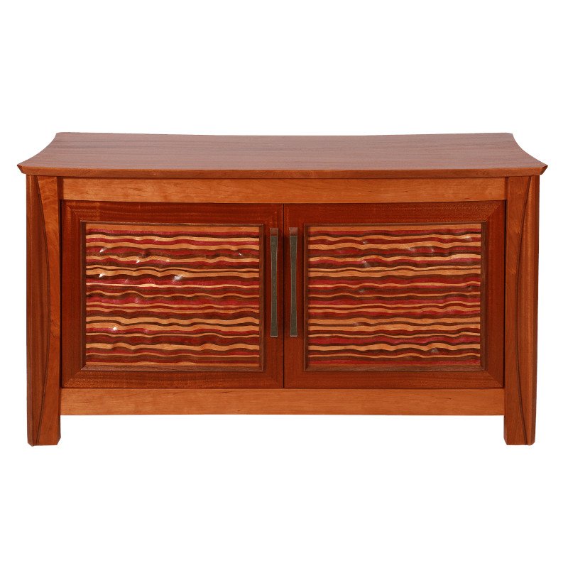 A wooden cabinet with two doors featuring a wavy carved striped pattern and metal handles.
