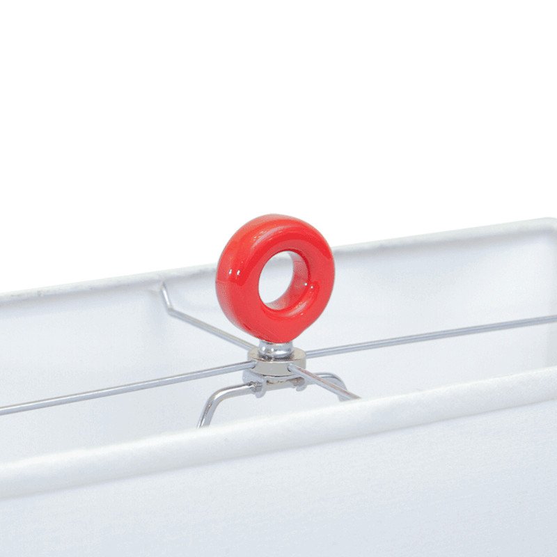 Close-up of a custom lamp finial with red metallic paint.