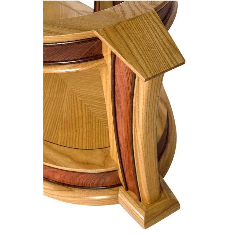 Close-up of a wooden coffee table leg showing various types of wood in different colors and grains.