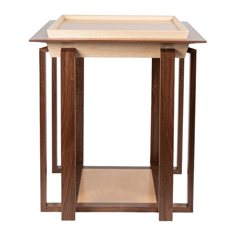 A wooden display table with a light-colored tray on top and a bottom shelf, supported by eight tall, rectangular legs.