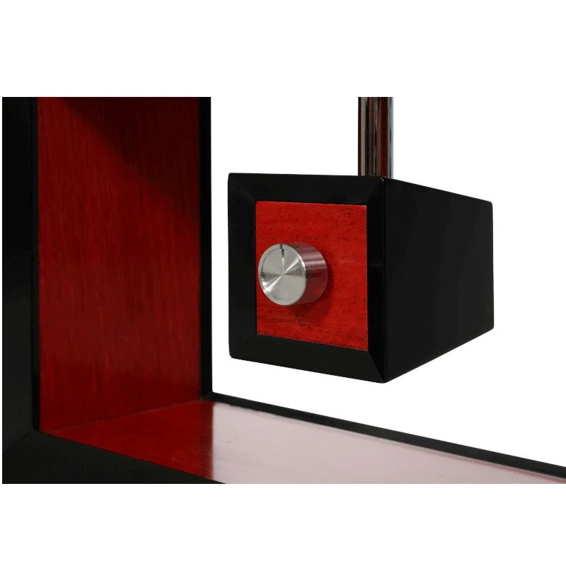 Close-up of a black and red wooden lamp switch with a silver control knob.
