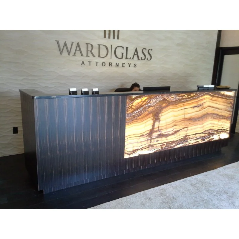 Reception desk with ebony veneer and onyx stone