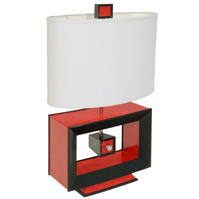 A modern table lamp with a rectangular red and black base, a large white oval lampshade, and a small red and black finial on top of the lampshade.