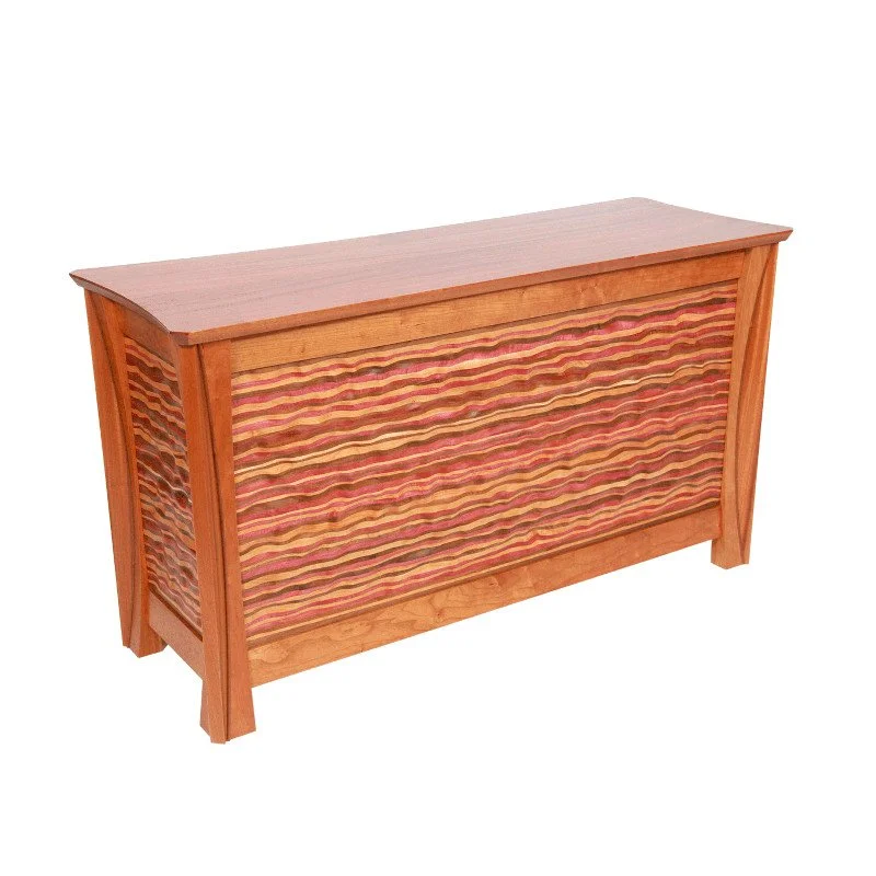 A wooden credenza with colorful wavy-patterned panels.