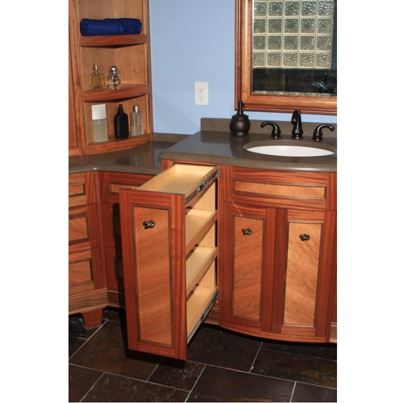 Bathroom vanity with open drawer, wooden cabinets, a black faucet, and a mirror above the sink.