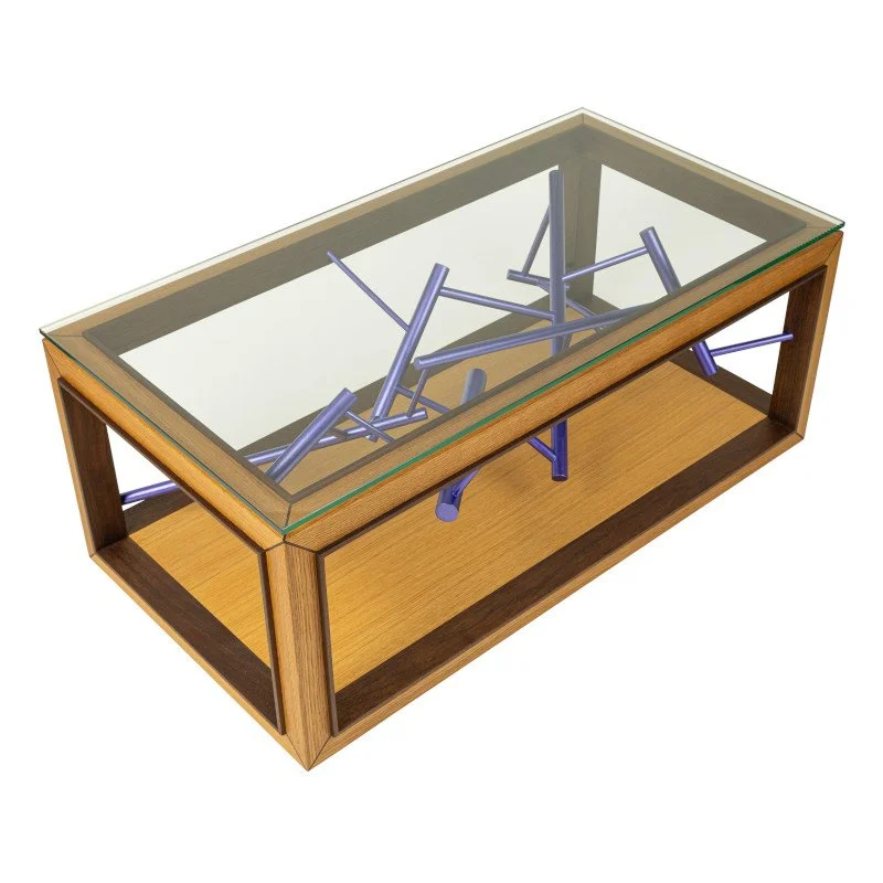 A rectangular wooden coffee table with a glass top and random purple sculpture inside.