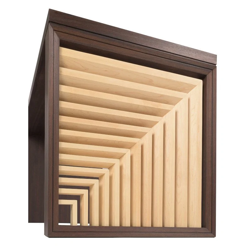 Wooden desk end panel with repetitive pattern.