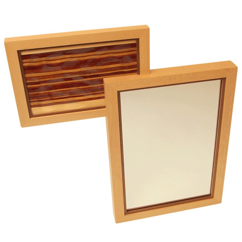 Two rectangular wooden framed areas, one with a mirror and the other with a carved decorative wooden design.