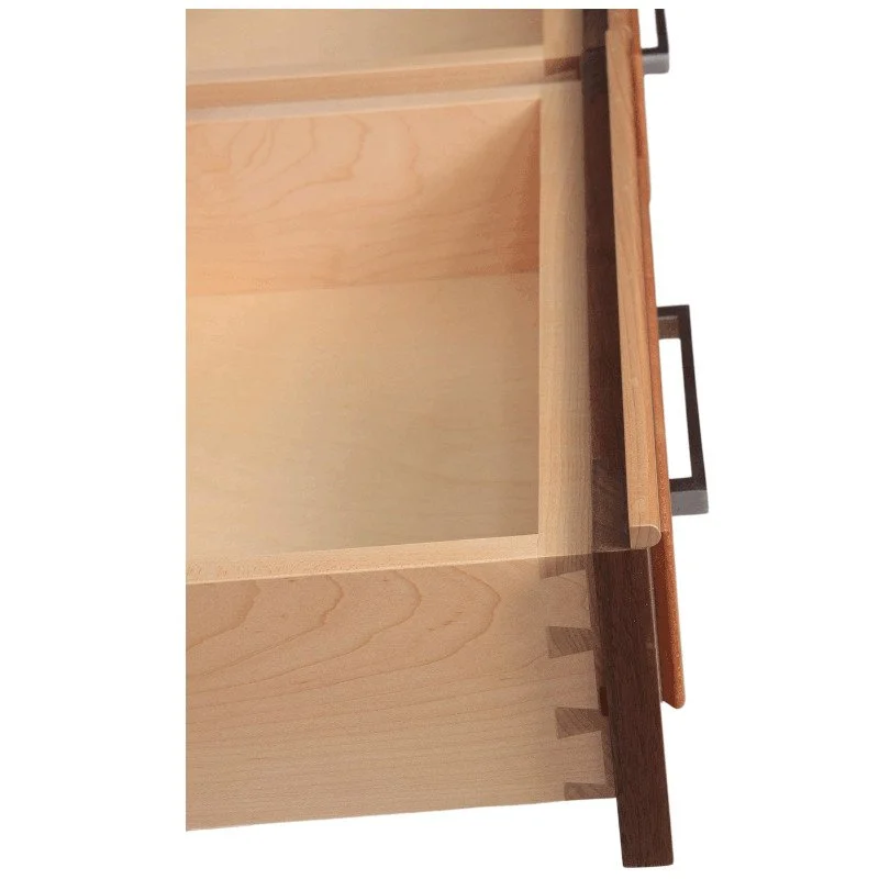 Close-up of an open wooden drawer, showing dovetail joints.