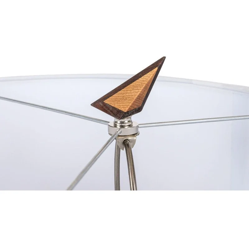 Close-up of a modern desk lamp with a wooden accent on shade.