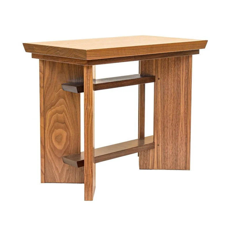 A wooden side table with a rectangular top and two horizontal stretchers underneath.