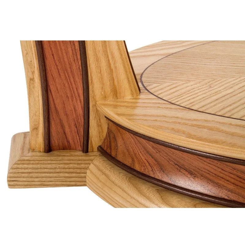 Close-up of a wooden coffee table, showing the different shades and grains of wood, including light and dark wood accents.