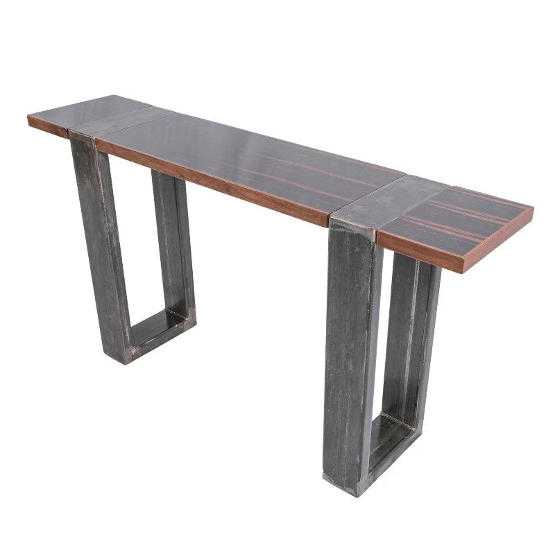 A modern wooden and metal table with a rectangular top and open rectangular legs.