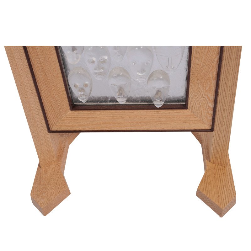 A wooden frame holding decorative art glass.