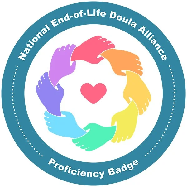 Circle logo for the National End-of-Life Doula Alliance featuring six colorful hands forming a heart shape in the center, with the text 'National End-of-Life Doula Alliance' and 'Proficiency Badge' around the perimeter.
