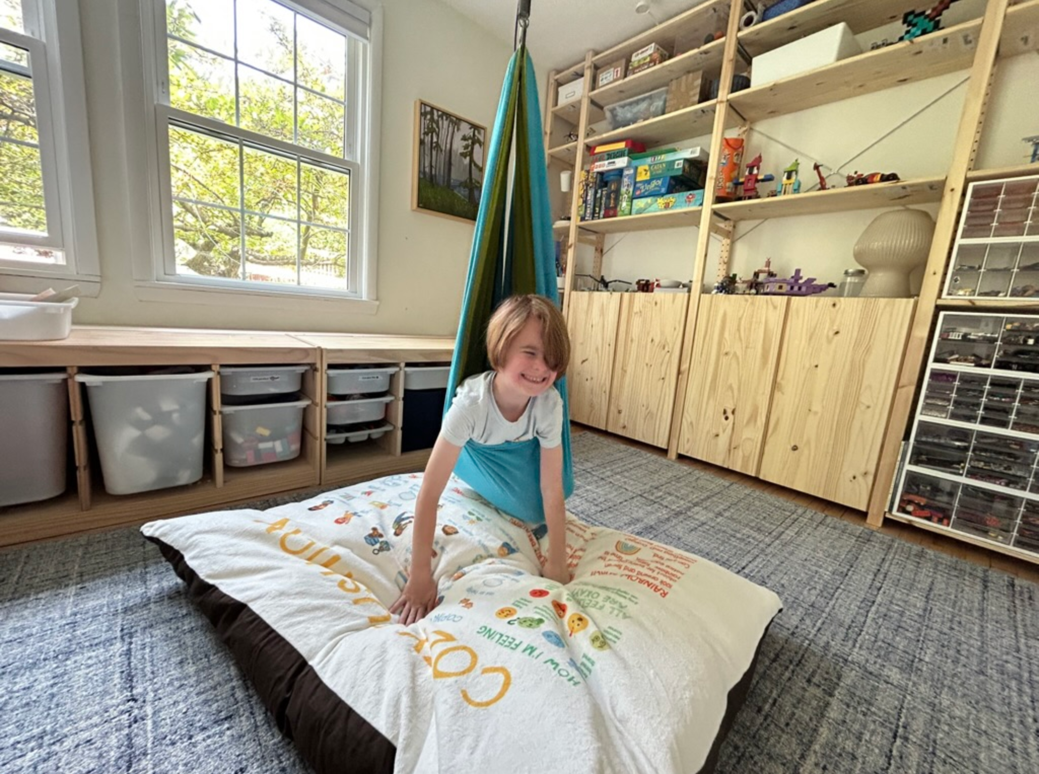 We added a crash pad, sensory swing, and and organized lego storage drawers for the ultimate play space!