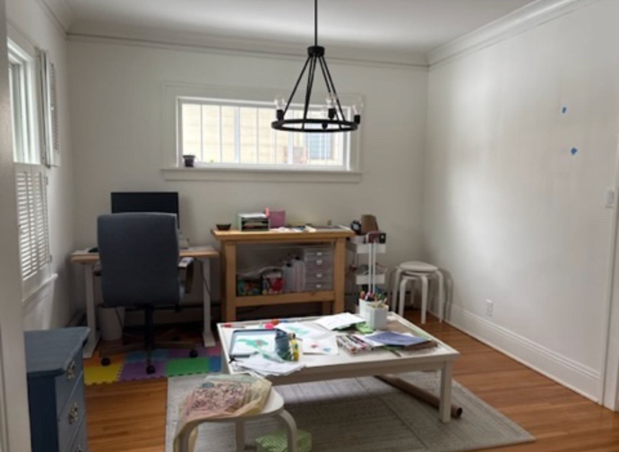 The client had an idea to make an office in her dining room: here, she is testing out the workspace location with furniture she already owned.