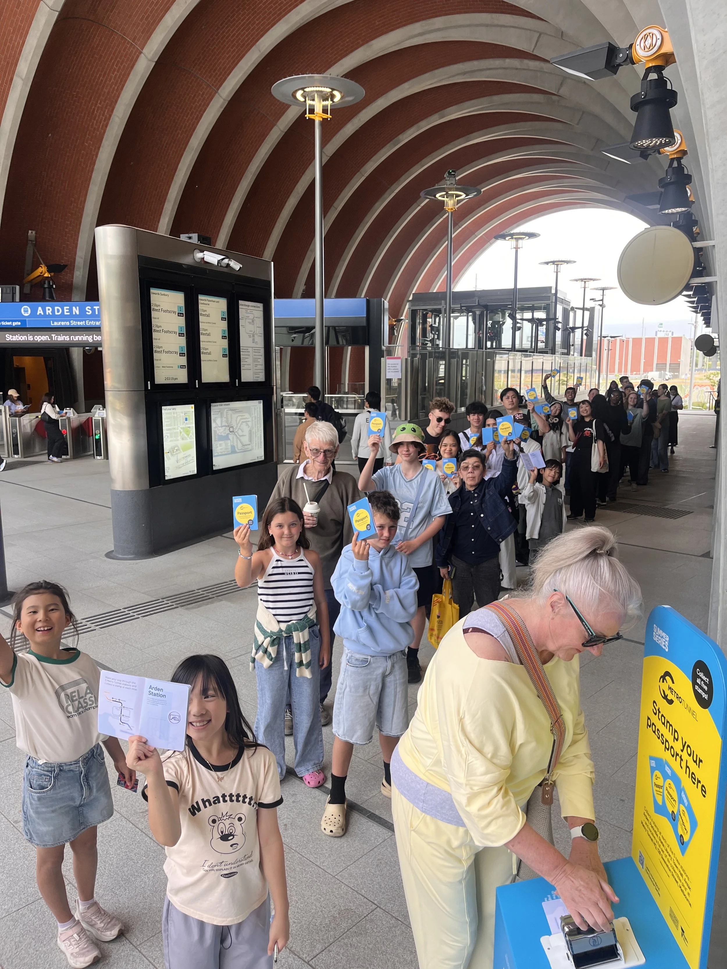 Patient passengers queue for the elusive stamp