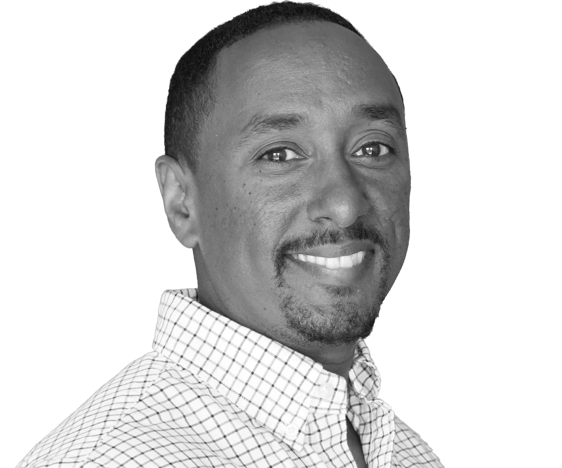 Black and white portrait of the owner of Palisade Home Watch smiling with short hair, wearing a checkered button-up shirt.