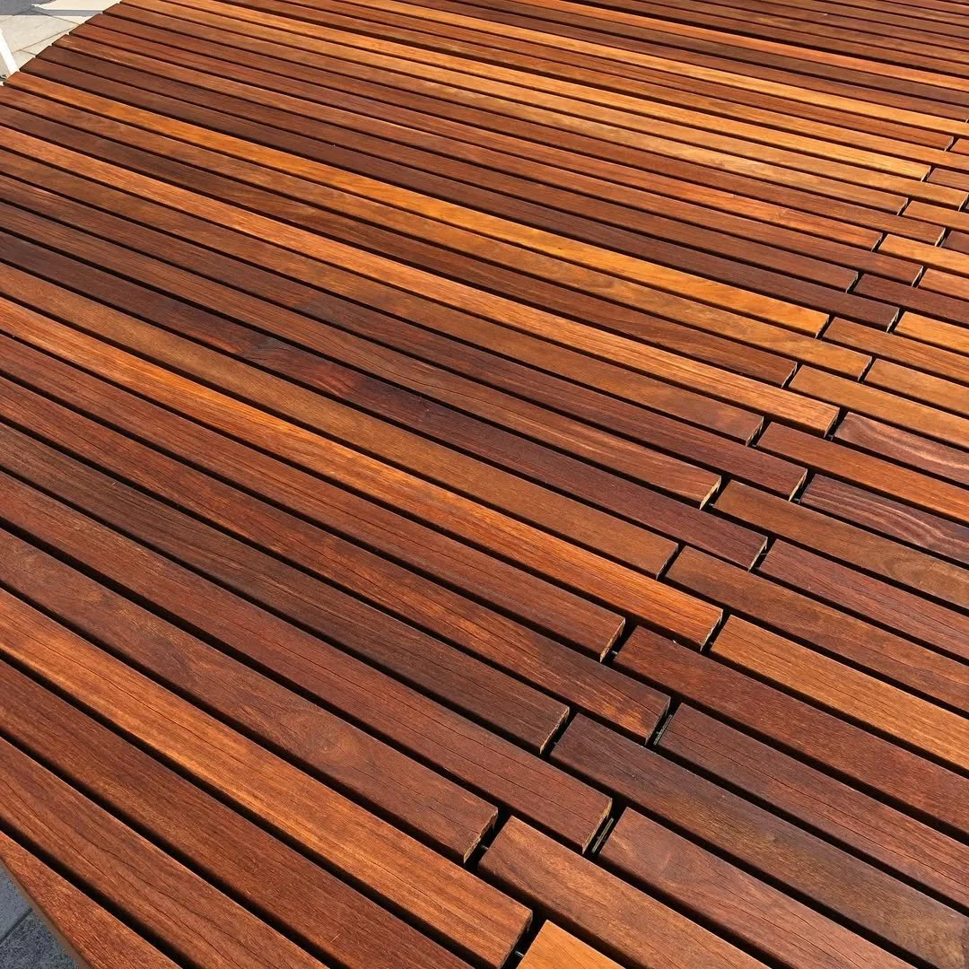 Close-up view of a wooden deck with evenly spaced horizontal planks.