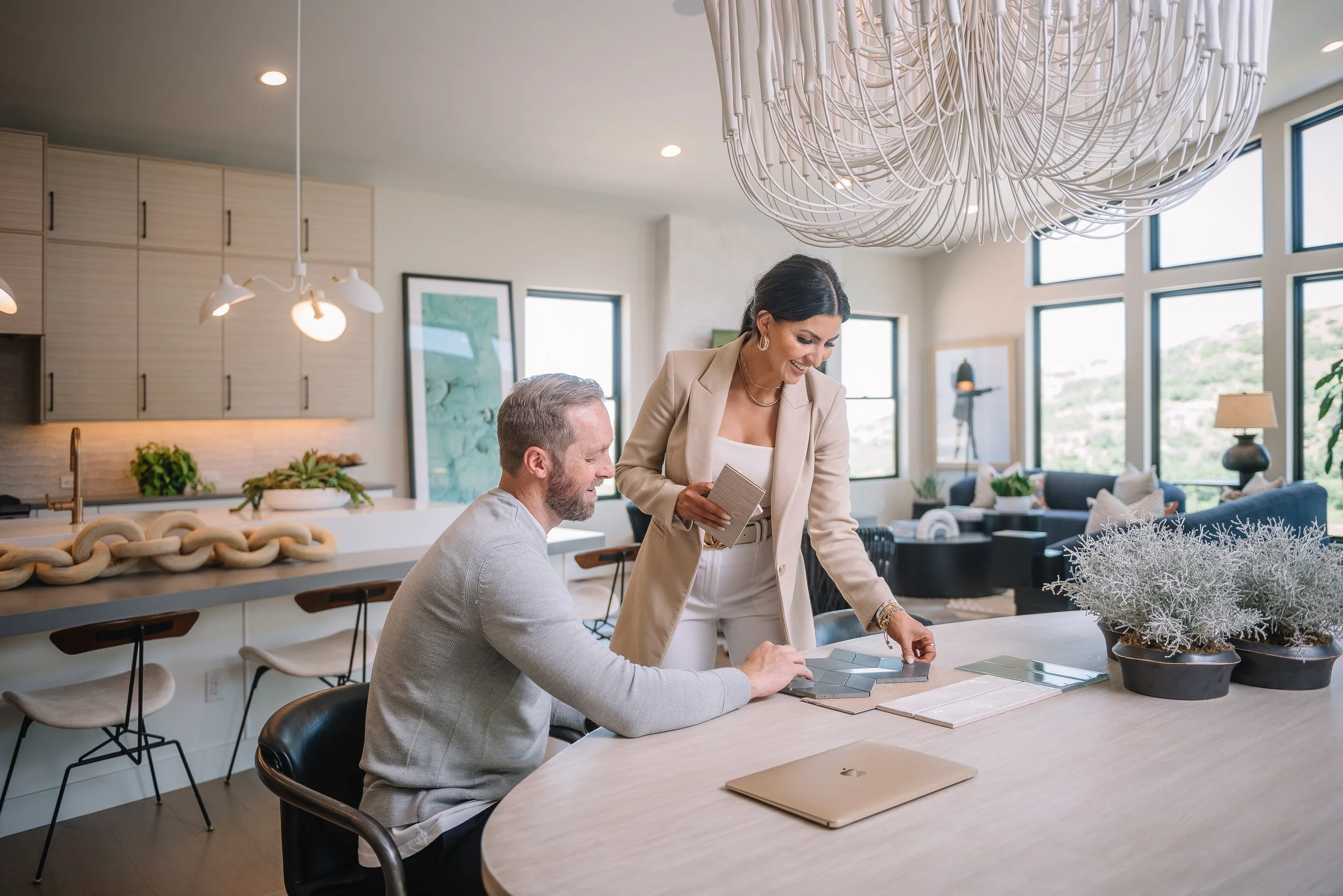 Ashley Lowery and Joe Lowery of The Lowery Group reviewing finish selections in a luxury home.