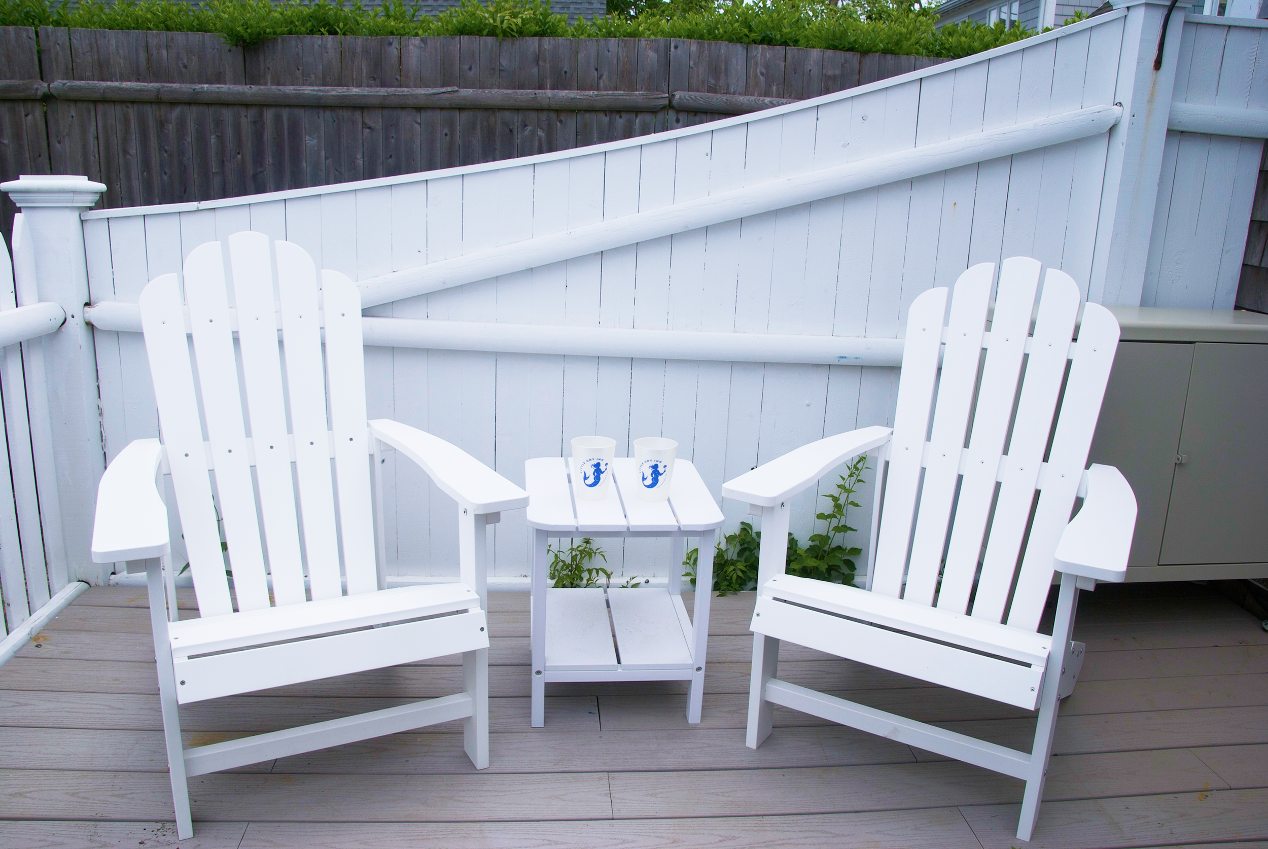 Relax in our two chairs with our logo branded cups