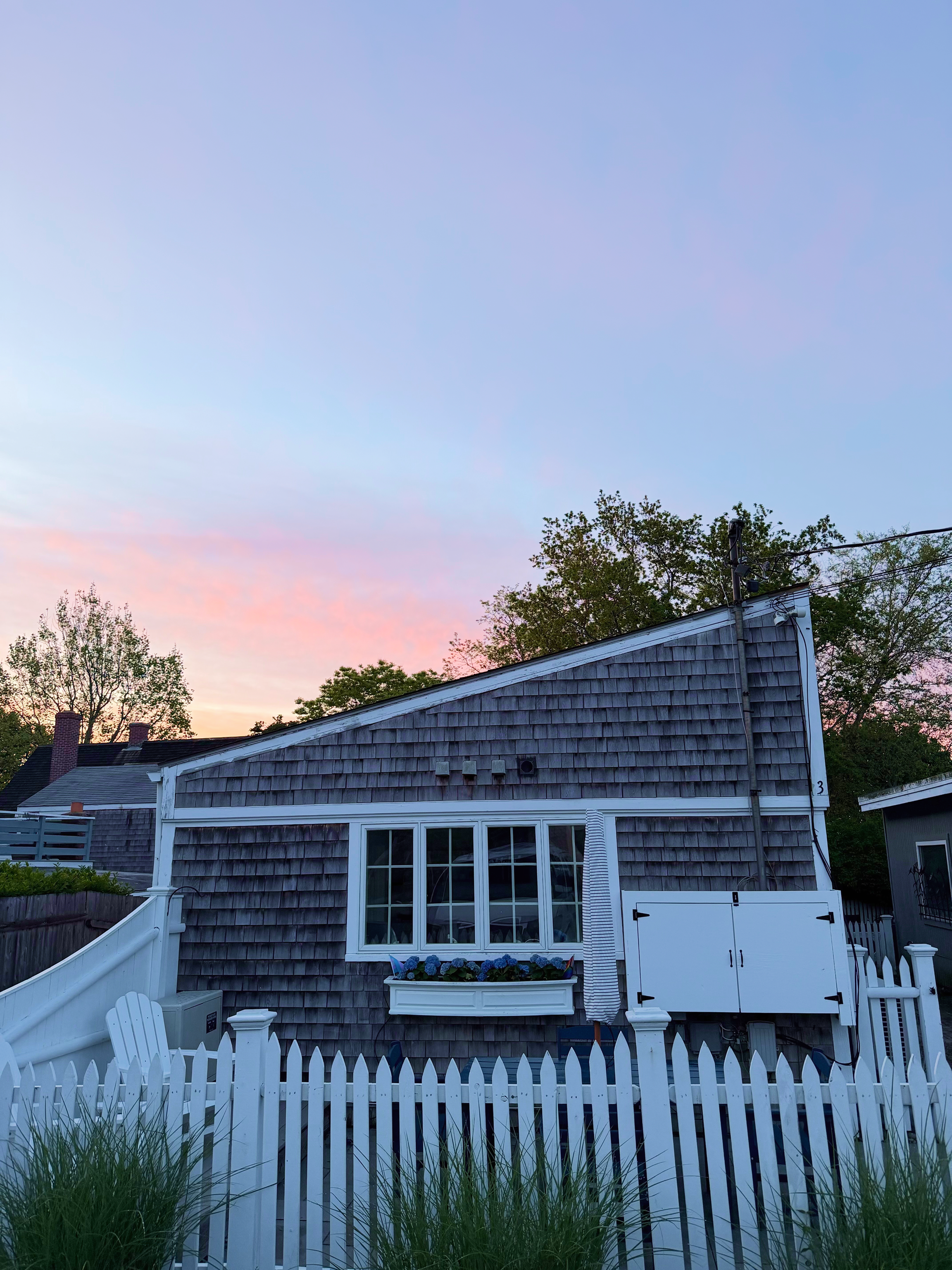 Little Gay Inn with a beautiful sunrise behind it.