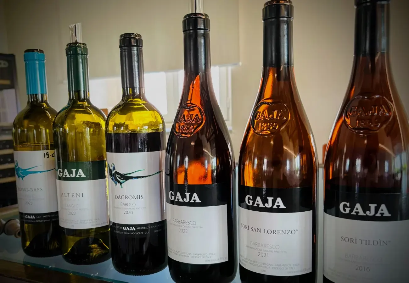 Six Gaja bottles including Gaia and Rey, Alteni di Brassica, Dagromis Barolo 2020, Barbaresco 2022, Sori San Lorenzo Barbaresco 2021, and 2016 Sori Tildin Barbaresco lined up for a private tasting with Vineyard Confidential.
