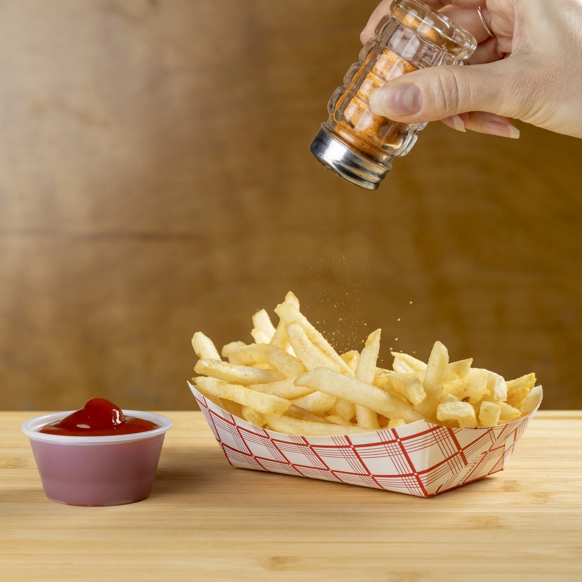 Commercial food photography for Riverside Lunch featuring their signature fries with seasoning.