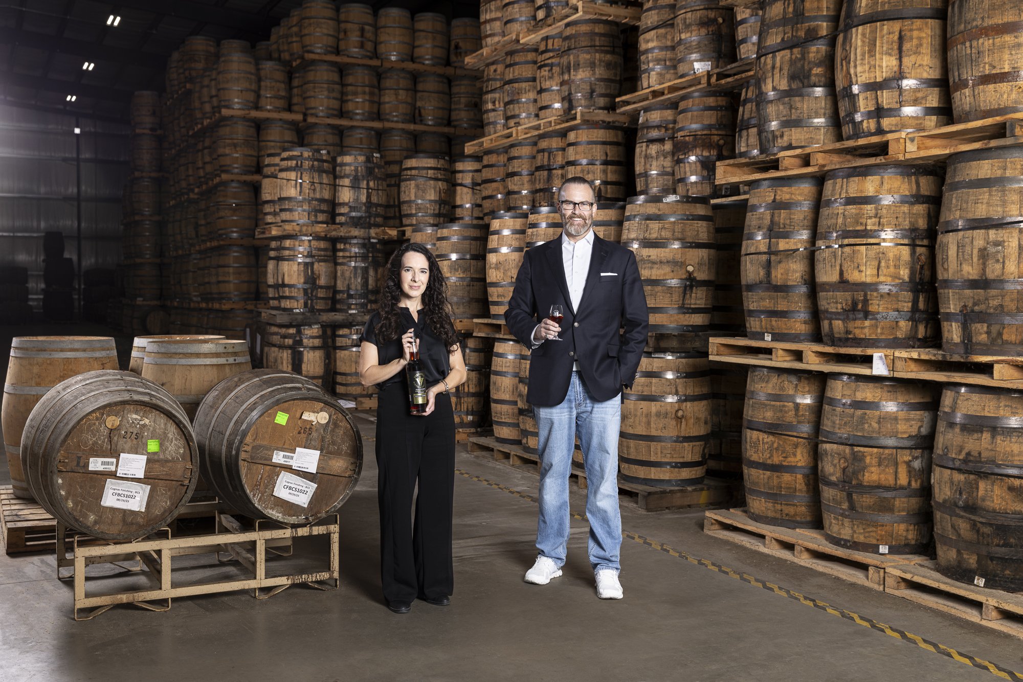 Editorial portrait of Virginia Distillery Co.'s owner Gareth Moore and lead blender Amanda Beckwith for C-VILLE Weekly.