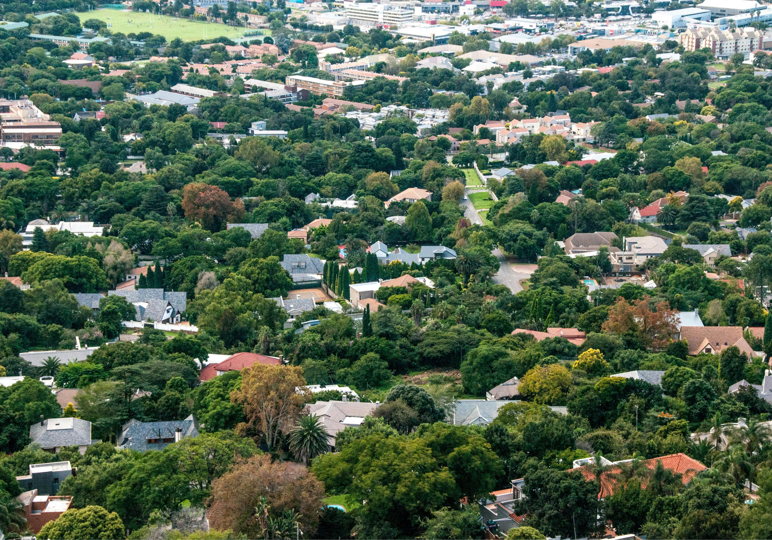 An aerial view of a sprawling investment neighborhood with profitable homes