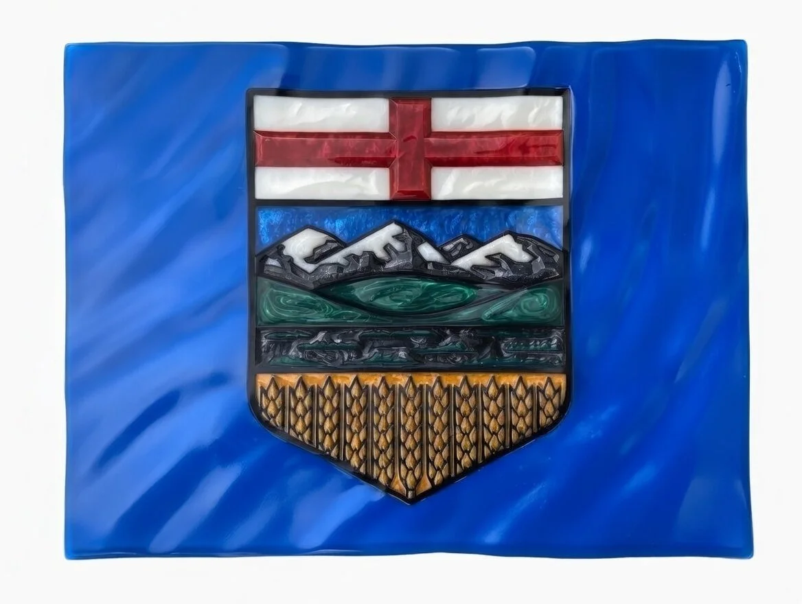 A 3D Epoxy Sculpture of the Alberta Shield. All elements are translucent with internal complexity, resembling gemstones. Each element of the shield is carved in 3D. The mountains are faceted like crystals, while the green hills are rounded.