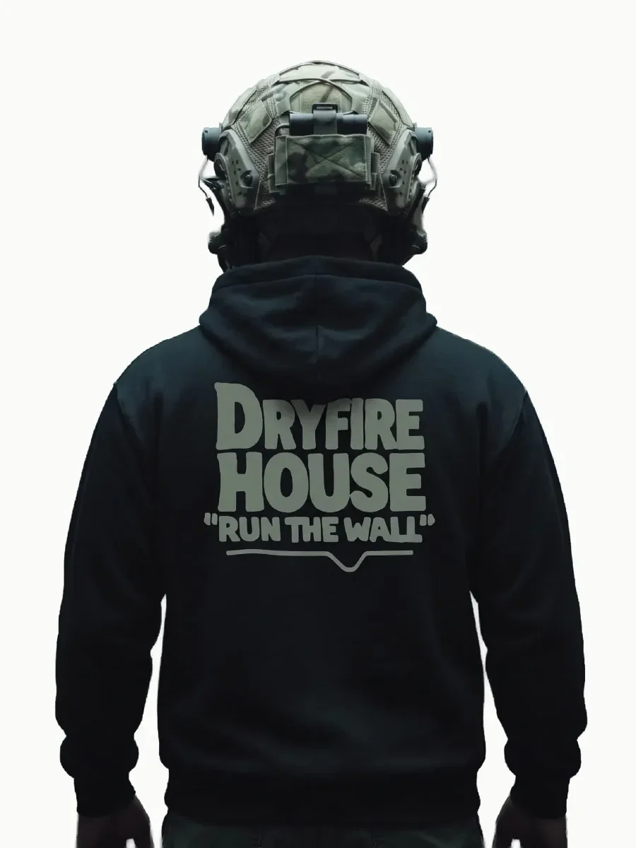 Rear view of a model wearing a black DRYFIRE HOUSE Run The Wall hoodie with a large back graphic.