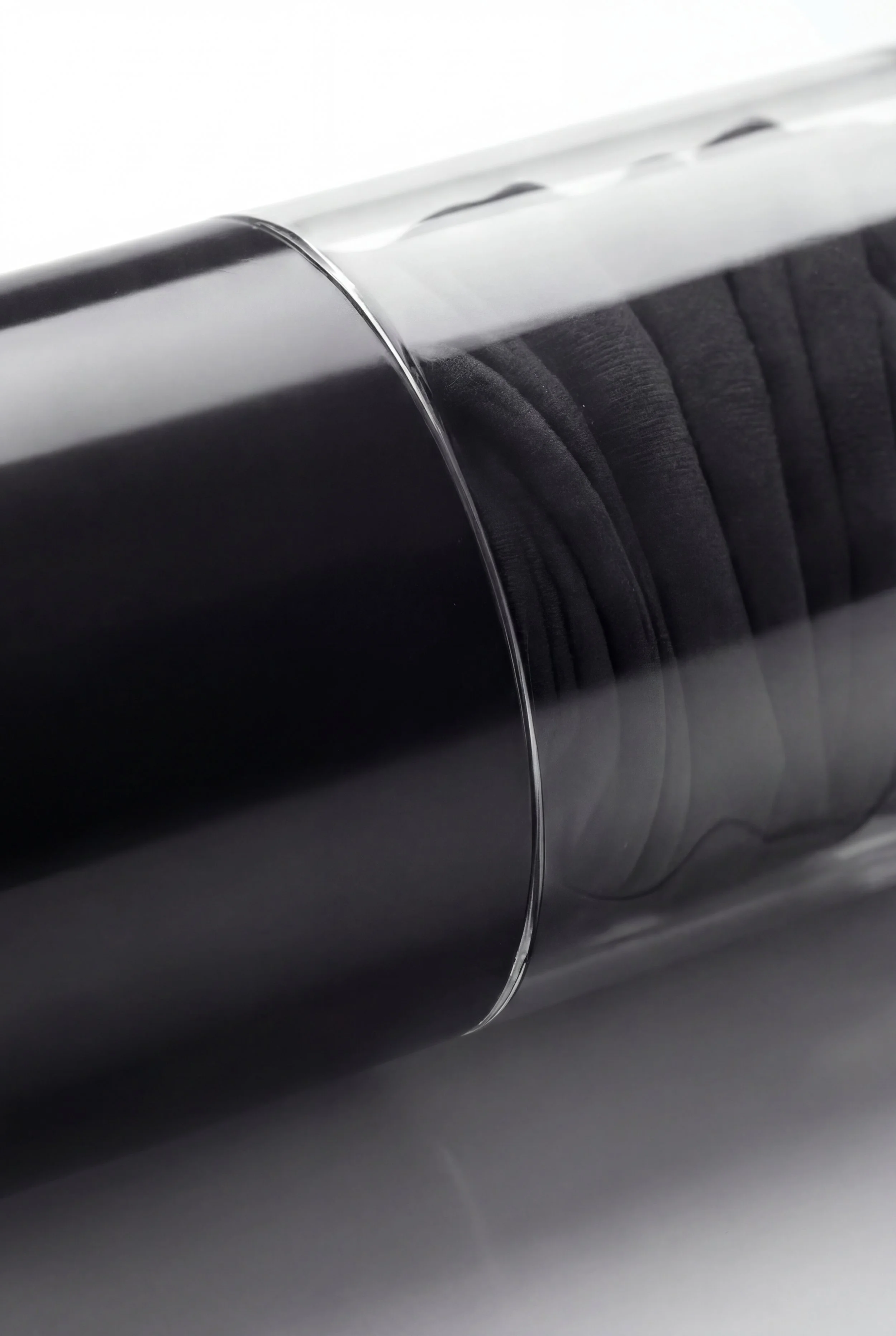 Close-up of a black speaker with fabric-covered cone and metal rim.