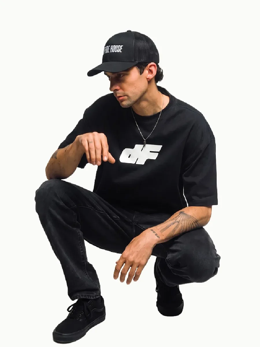 DRYFIRE HOUSE apparel collection featuring a model wearing a black DFH shirt and hat.