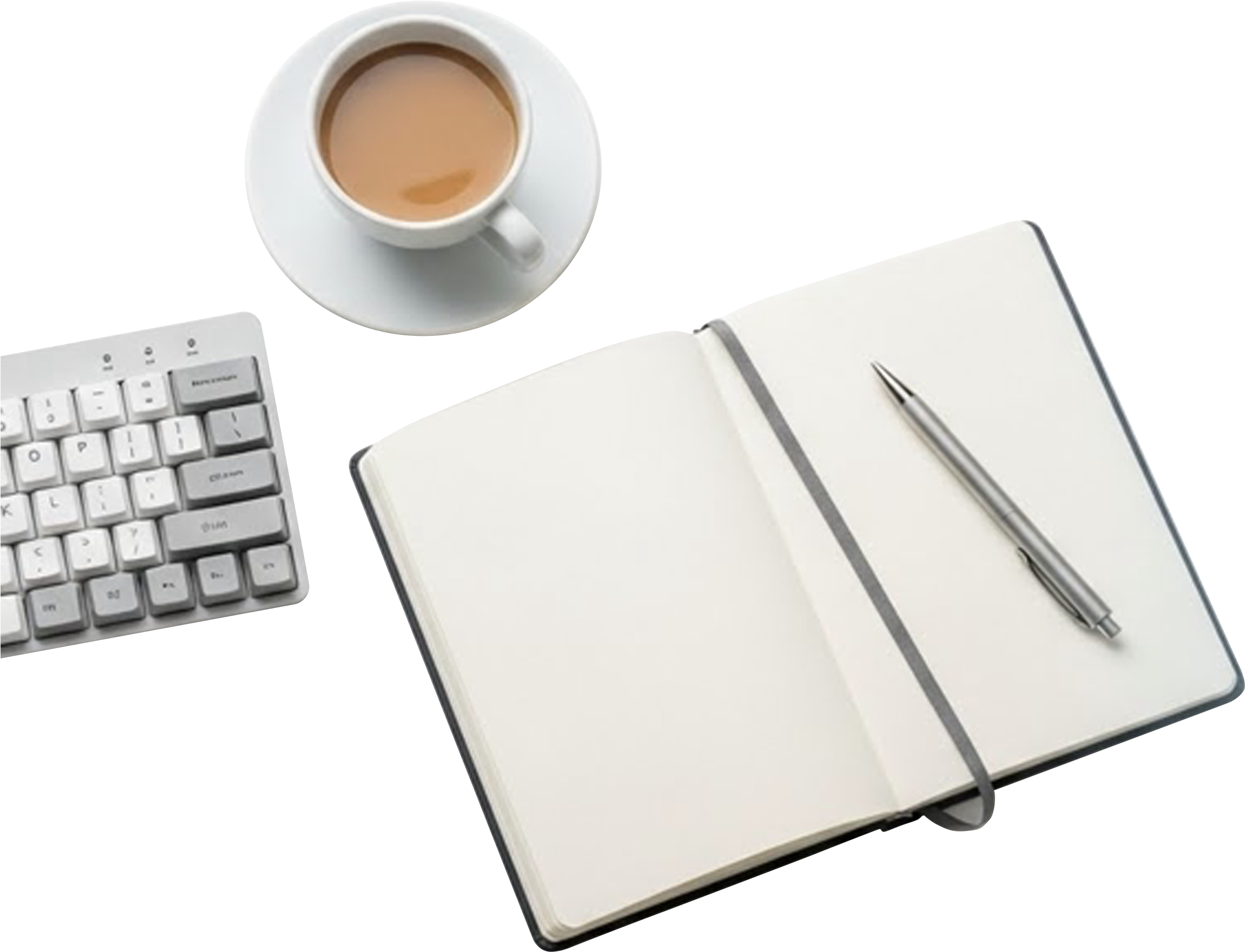 Top view of a white coffee cup filled with light brown coffee, placed on a white saucer. Nearby is an open blank notebook with a silver pen resting on it, and a computer keyboard is partially visible on the left side.