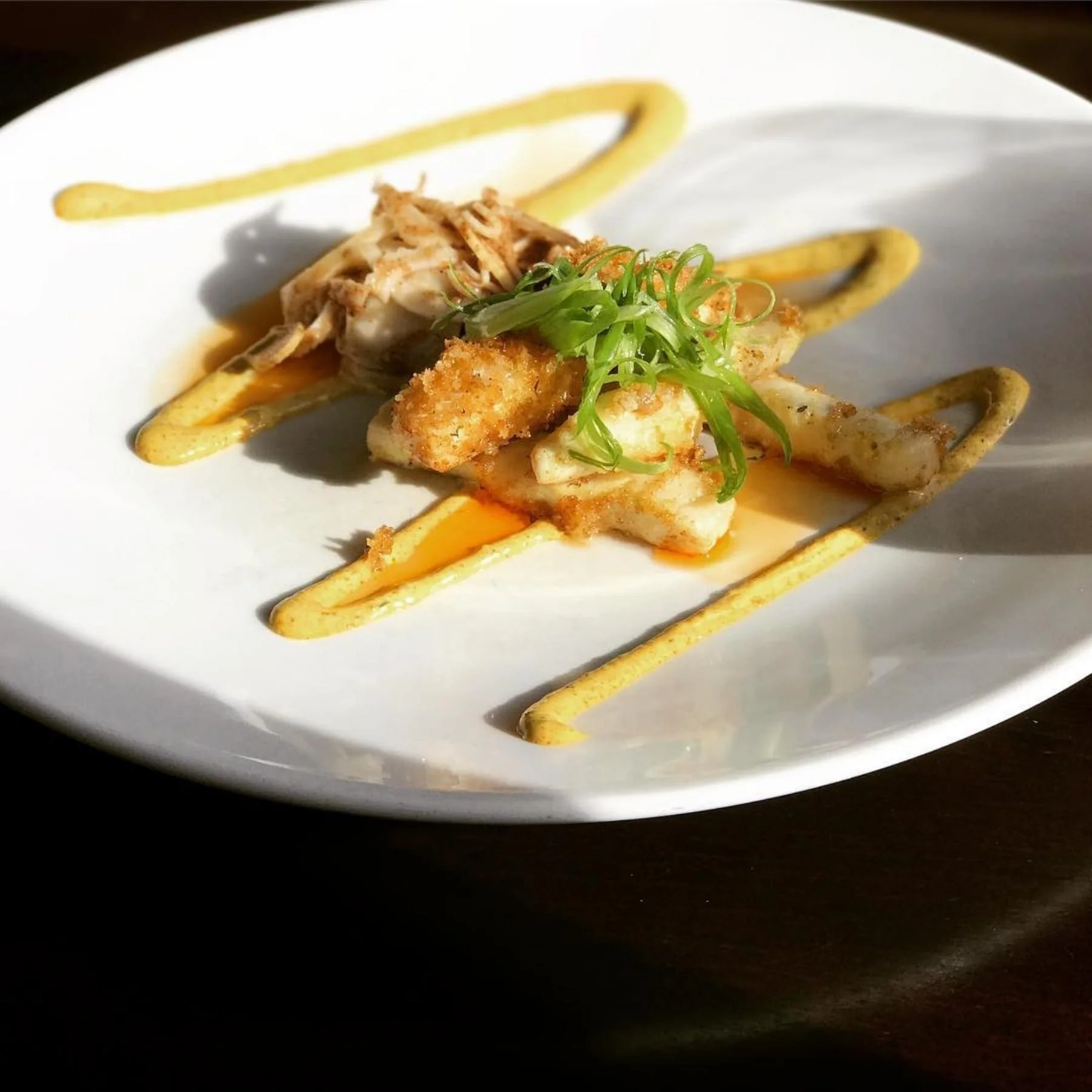 Seared scallop entrée plated in a fine dining restaurant in Breckenridge