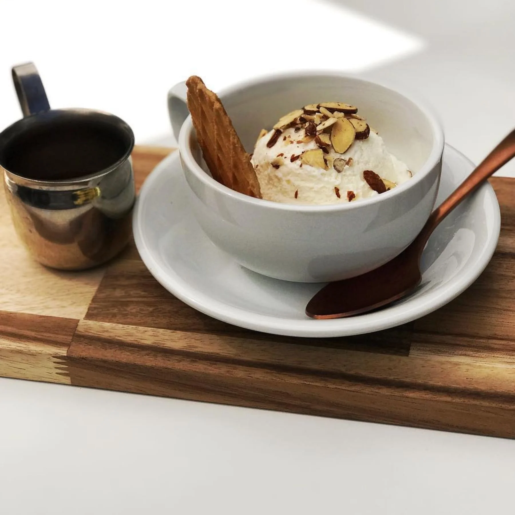 Affogato dessert captured at a coffee shop with a copper spoon