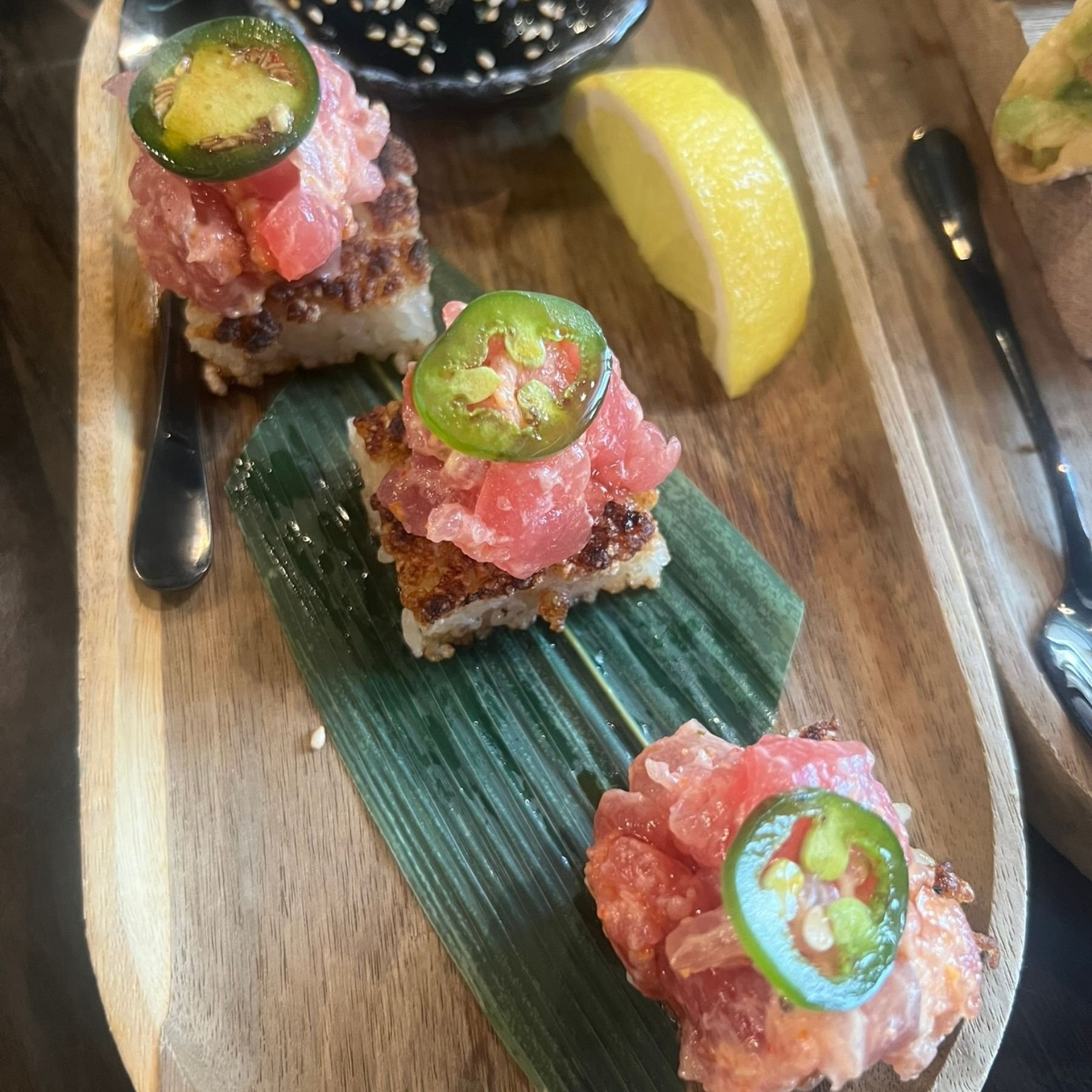 Crispy tuna appetizer served at a sushi bar