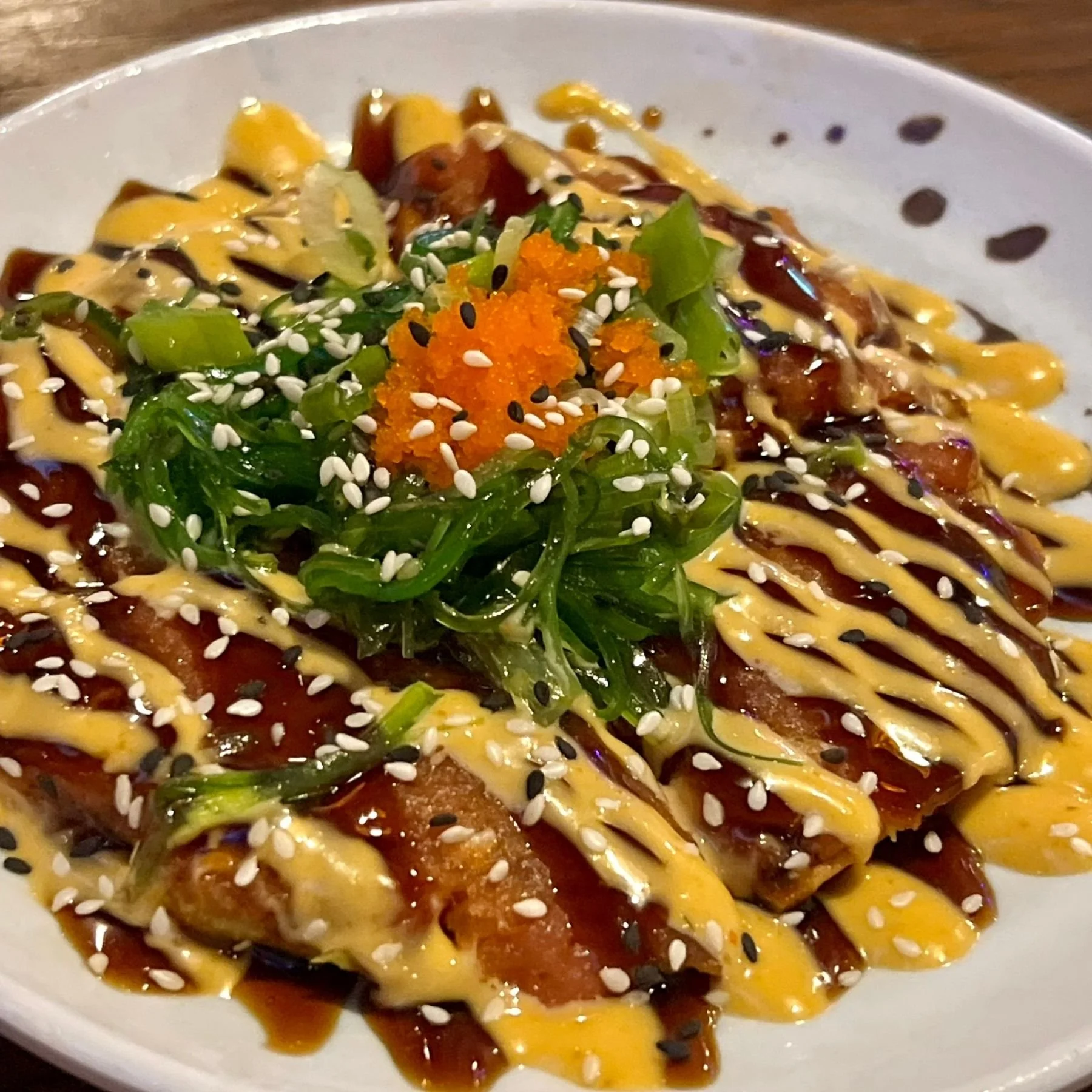 Crispy tuna appetizer served at a sushi bar