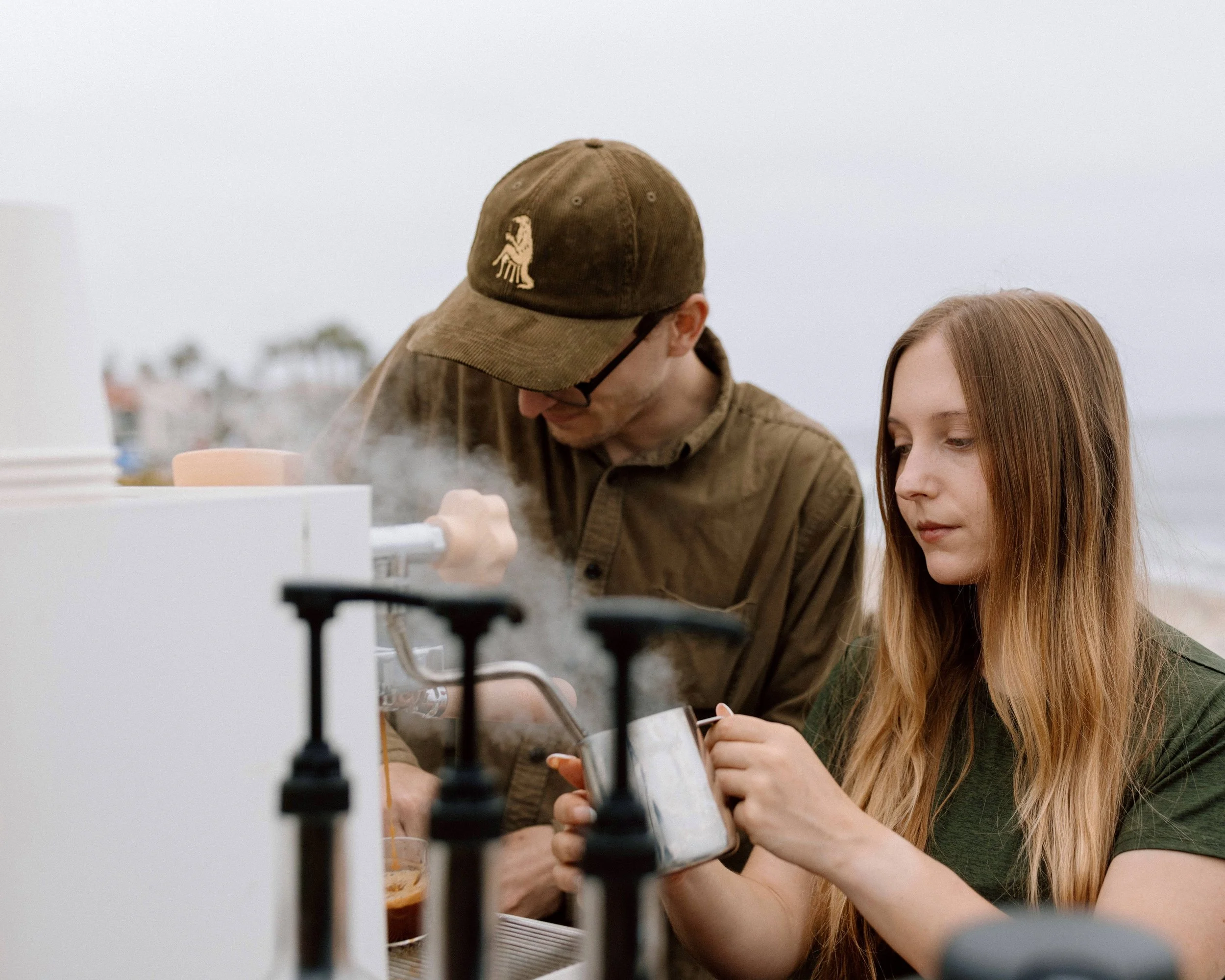 A man and a woman working in a laboratory, handling test tubes and laboratory equipment.