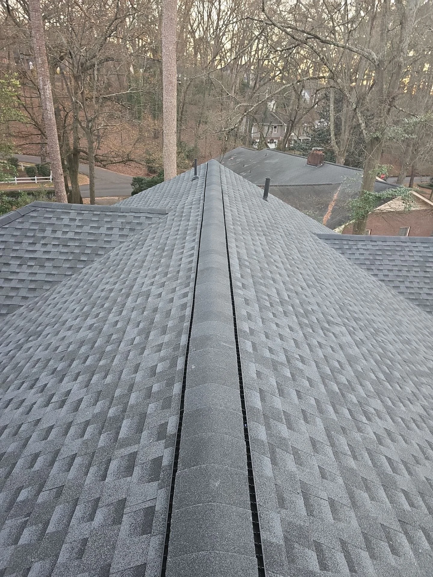Full residential roof replacement by CAMCO Roofing Services featuring luxury architectural shingle roof installed on a local home.
