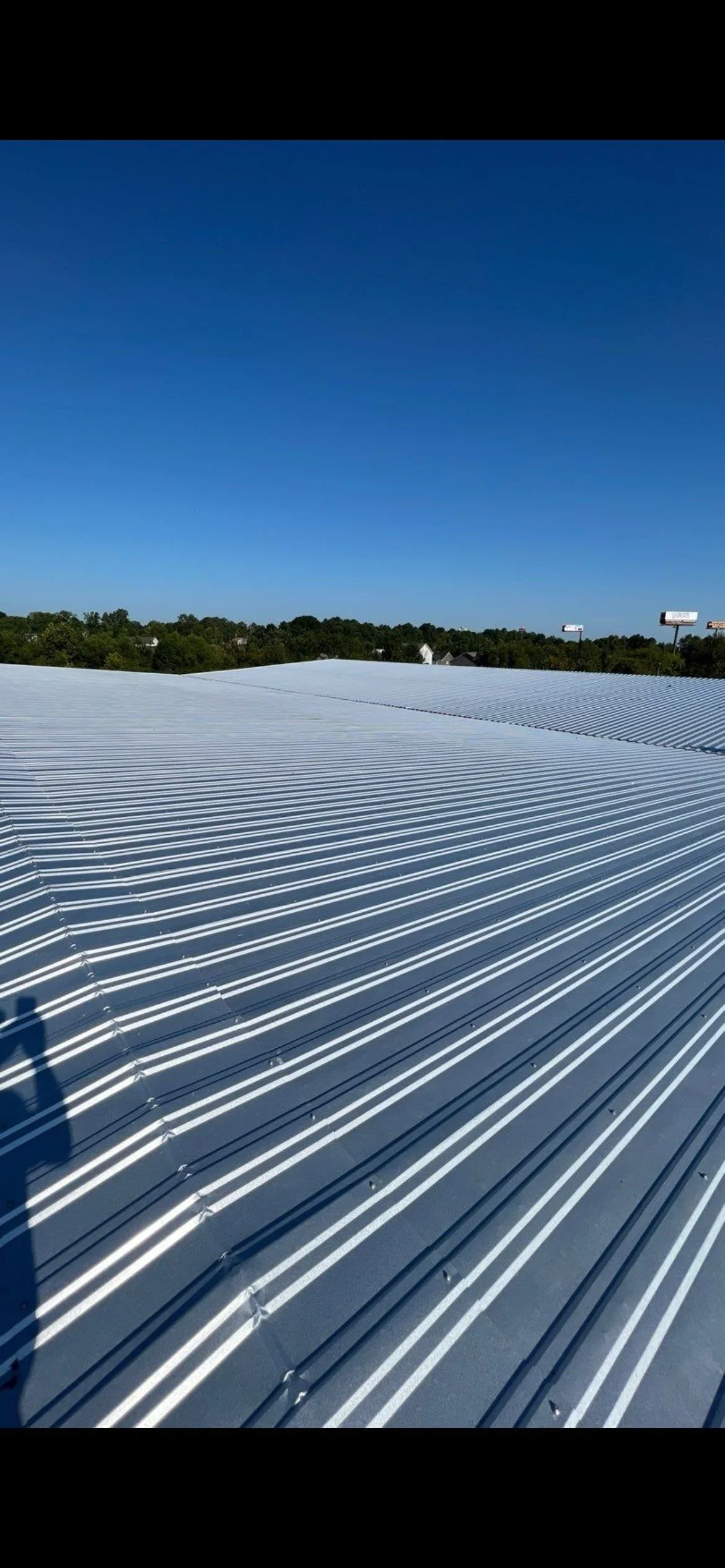 Expansive commercial metal roofing system installed by the expert commercial contractors at CAMCO Roofing Services, serving businesses across Rome and Metro Atlanta.