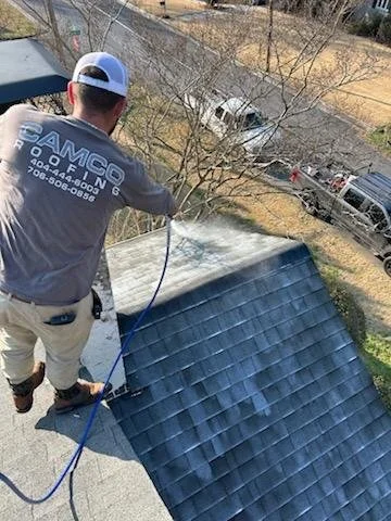 Applying USDA-certified, plant-based roof rejuvenation treatment to an asphalt shingle roof in Georgia to restore flexibility and add 6 years of life.