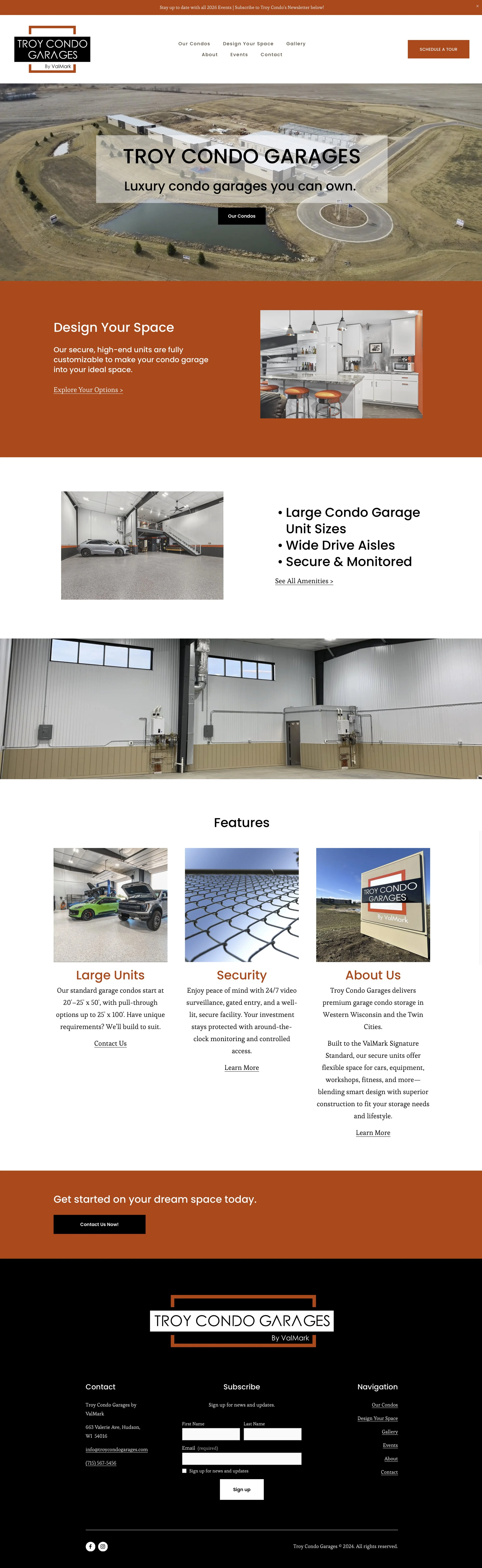 Homepage of Troy Condo Garages website featuring an aerial view of a large condo garage complex with a pond, followed by sections about design options, garage features, images of interior and exterior garage units, and company information with a red, black, and white color scheme.