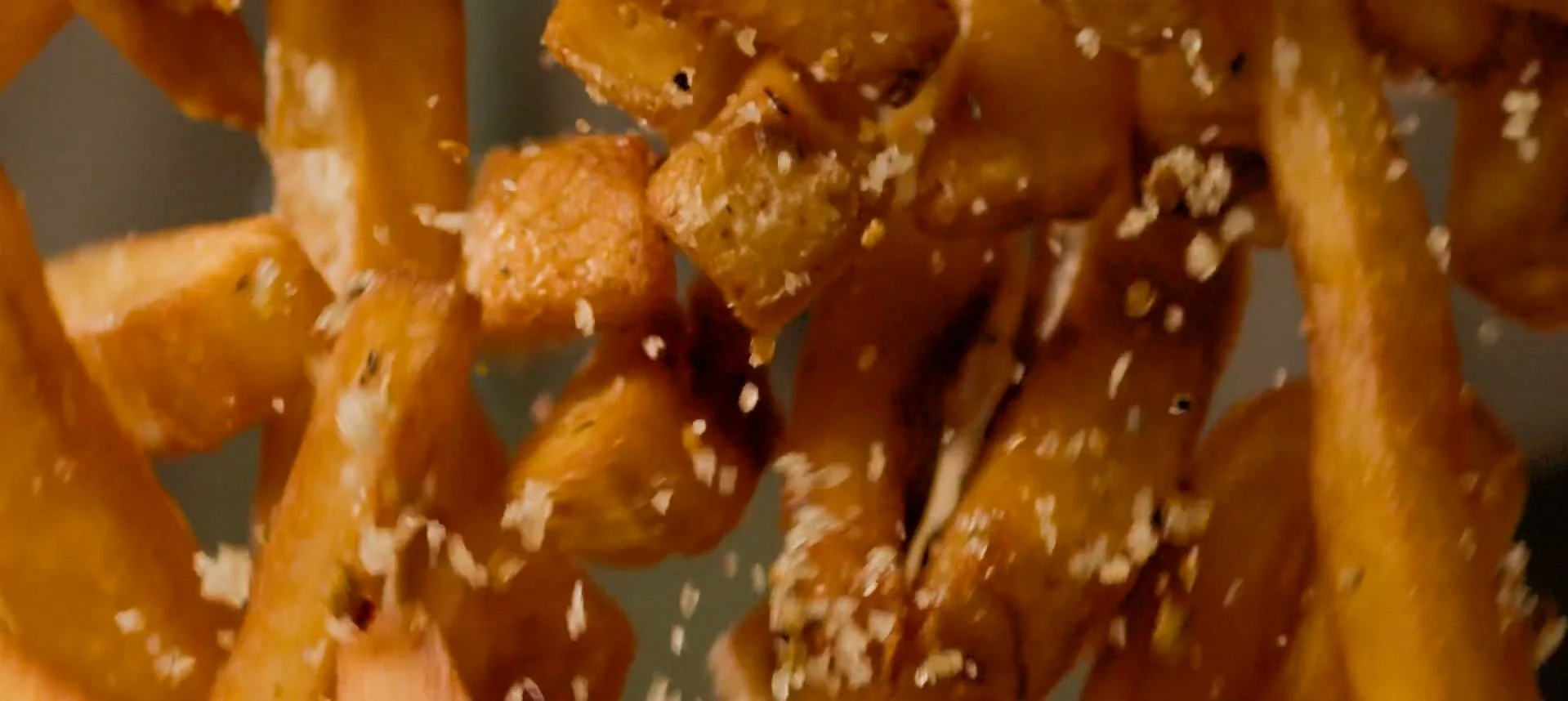 french fries being thrown mid air