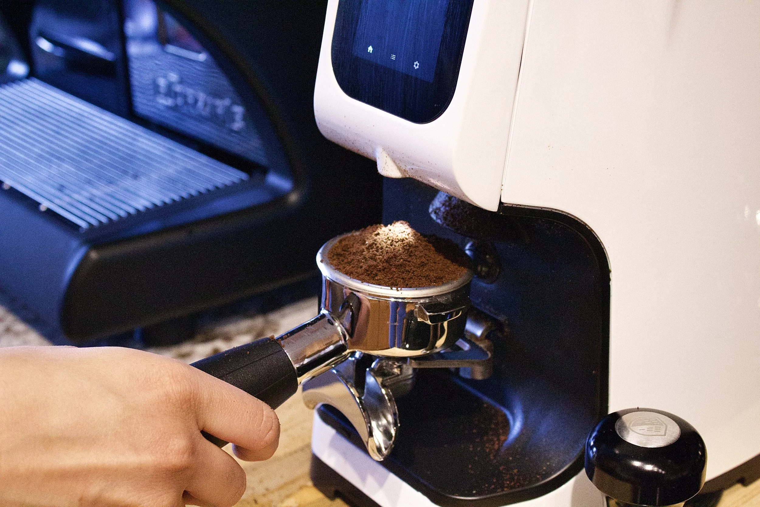 Fresh espresso being ground at Milk n Honey Coffee Company’s Minneapolis mobile coffee cart for weddings and corporate events.