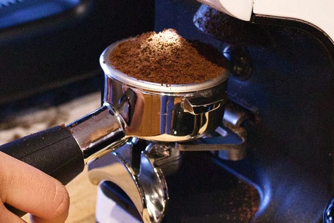 Fresh espresso grounds in a portafilter at Milk n Honey Coffee Company’s mobile coffee cart, serving handcrafted espresso drinks at Minneapolis and Twin Cities events.